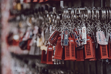 London red post box key chains on sale at a street market in London, UK.