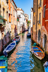 Fototapeta na wymiar Historic buildings by the canal in Venice, Italy
