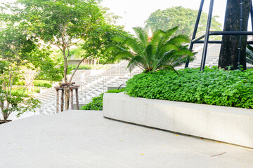 Empty Staircase to blue sky at rooftop and garden in morning,Long stair concrete in office building.