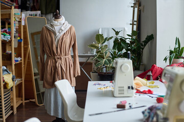Background image of atelier workshop interior with mannequin, no people, copy space