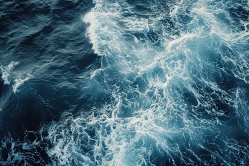 In this photo, a large body of water showcases its power as massive waves crash relentlessly against the shore, A top view of ripples and waves in the ocean, AI Generated - obrazy, fototapety, plakaty