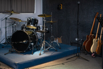 Fototapeta na wymiar Drum kit, guitars, microphones in the recording studio.