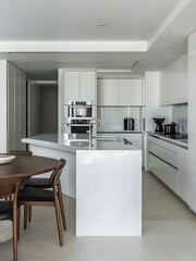 Stylish kitchen interior showcasing white marble island, dining table, and chairs.