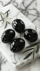Single black olive fruit isolated on white background for culinary or design use