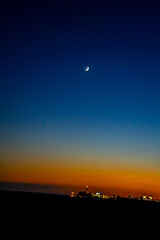 Sunset, Moon and Evening Sky over Maspalomas on Gran Canary Island Spain.