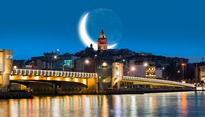 Galata Tower, Galata Bridge, Karakoy district and Golden Horn at 
 the morning with crescent moon -...