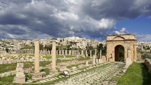Roman ruins (against the background of a beautiful sky with clouds, 4K, time lapse) in the Jordanian city of Jerash (Gerasa of Antiquity), capital and largest city of Jerash Governorate, Jordan