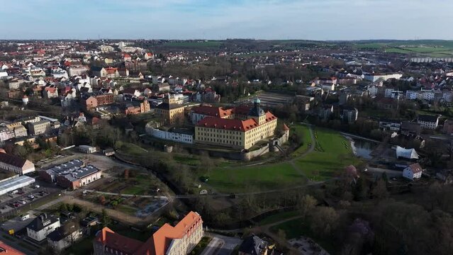 View over the Zeitz city center and Moritzburg Castle. Castle park in the valley. Residential district of Zeitz on the hills. Small town in Saxony-Anhalt.