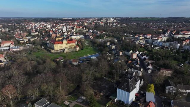 Flight around the city of Zeitz. Zeitz Castle is centrally located. The districts are spread over the adjacent hills. Residential district of Zeitz in the background. Small town in Saxony-Anhalt.