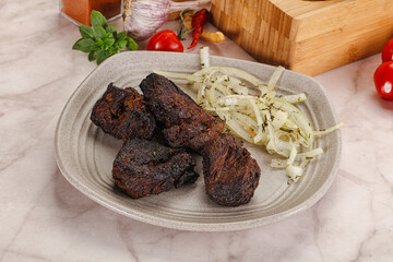 Grilled beef barbecue served onion