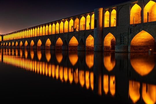 Iran. Isfahan. Allahverdi Khan Bridge by night (also known as Si-o-se-pol - bridge of "thirty-three spans")