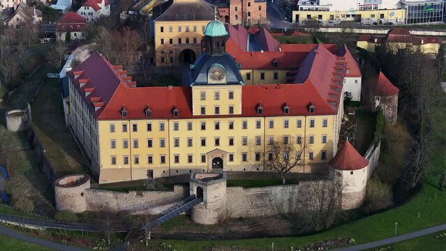 Telephoto shot of the castle in Zeitz. Slow flight around Moritzburg Castle, from the north side to the south side. Evening atmosphere in spring. City in Saxony-Anhalt.