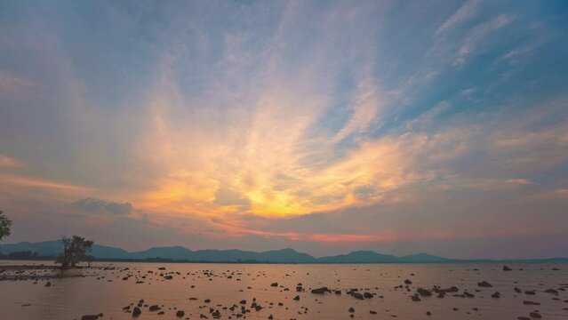 Time lapse Amazing sunset cloud formation in colorful ..Time lapse Beautiful sunsets are accompanied by soft clouds floating in stunning sky..Beautiful sunsets soft clouds floating above the sea.