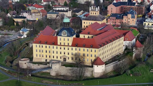 Telephoto shot of Moritzburg Castle in Zeitz. Flight around the castle in spring. Last rays of sunshine before sunset. Small town on the edge of Saxony-Anhalt.