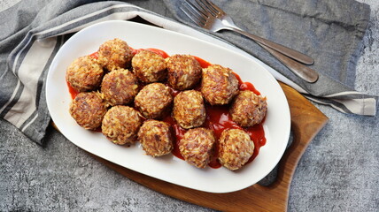 Meatballs in sweet and sour tomato sauce. Top view