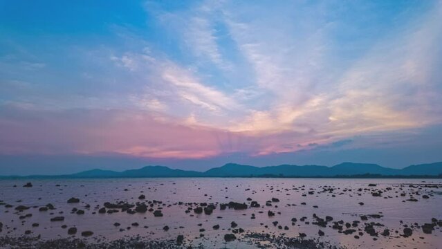 Time lapse Amazing sunset cloud formation in colorful ..Time lapse Beautiful sunsets are accompanied by soft clouds floating in stunning sky..Beautiful sunsets soft clouds floating above the sea.