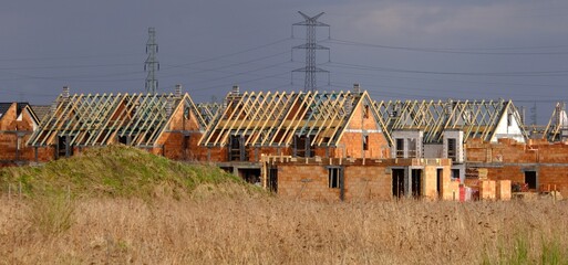 A housing estate of single-family houses under construction. Roof construction.