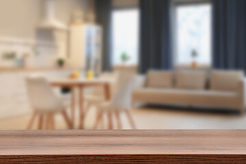 Empty wooden table in dining room. Space for design