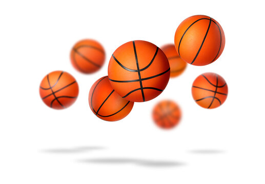Many basketball balls falling on white background