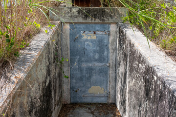 Heavy steel door protecting abandoned underground bunker