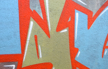 Colorful background of graffiti painting artwork with bright aerosol outlines on wall. Old school...