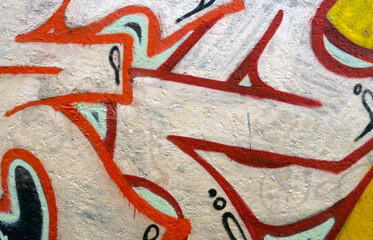 Colorful background of graffiti painting artwork with bright aerosol outlines on wall. Old school street art piece made with aerosol spray paint cans. Contemporary youth culture backdrop
