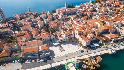 Behold the enchanting beauty of the historic town of Rab, nestled on the picturesque island of Rab in Croatia сaptured from a drone