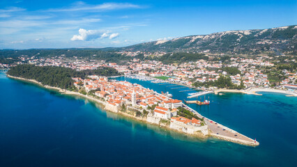 Behold the enchanting beauty of the historic town of Rab, nestled on the picturesque island of Rab in Croatia сaptured from a drone