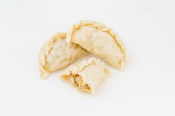 Northeastern large dumplings with vegetarian stuffing on white background