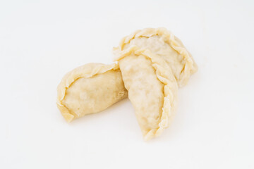 Northeastern large dumplings with vegetarian stuffing on white background