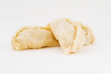 Northeastern large dumplings with vegetarian stuffing on white background