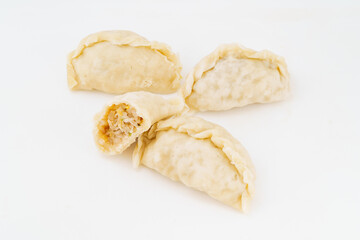 Northeastern large dumplings with vegetarian stuffing on white background