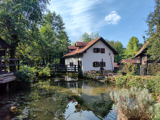 Landscape of Korana river canyon and beautiful village of Rastoke near Slunj in Croatia, old water mills on waterfalls, beautiful countryside © Snjeana