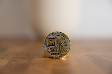 Macro view of gold and silver color shiny coins with Bitcoin symbol.