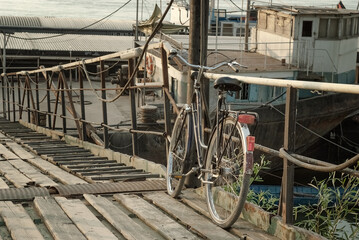 Vintage Bicycle Parked on Rusty Dockside