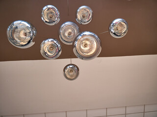 Modern ceiling lamps background, round lamps over ceiling pattern