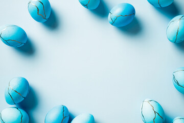 Elegant Easter background with blue Easter eggs on pastel blue table. Minimal style.