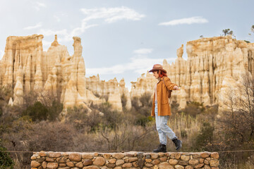 A woman in a brown jacket