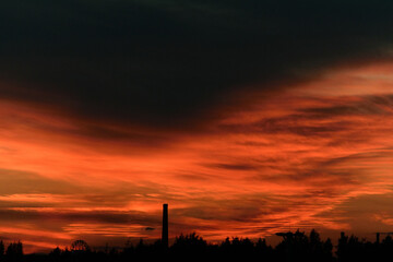 Black and red heavy sky after sunset, evening dark twilight
