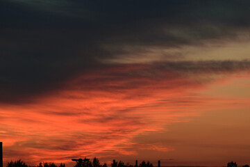 Black and red evening sky above the horizon, night twilight, dramatic atmosphere