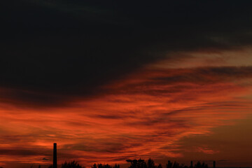 Black and red evening sky above the horizon, night twilight, dramatic atmosphere