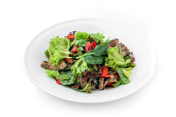 Healthy salad with grilled beef meat, tomatoes, bell pepper, lettuce, arugula, french bean and sauce in plate isolated on white background. Healthy food, top view