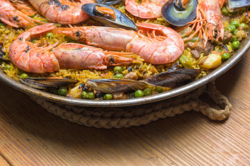 Aromatic shrimp paella with peas and mussels, rich in Mediterranean flavors, typical Spanish cuisine, Majorca, Balearic Islands, Spain