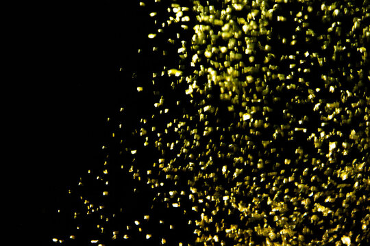 Golden sparkling on black background.