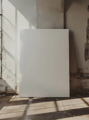 large blank canvas against the wall in an empty room
