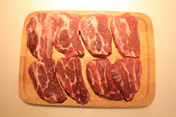 raw meat on a wooden board
