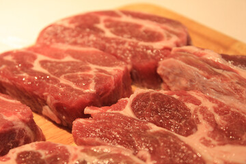 raw meat on a wooden board