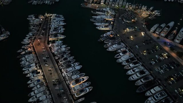 Time-lapse over the Bay of Billionaires in Antibes, South of Frane. Drone footage from above as a super yacht gets docked in for the night. 