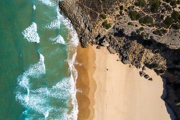 Algarve Coast in Portugal. Aerial drone view over sandy beach and Atlantic Ocean