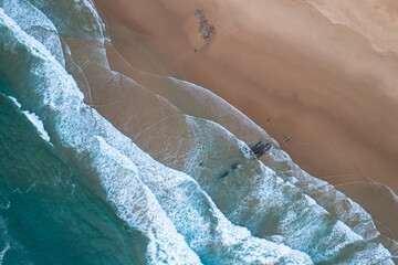 Algarve Coast in Portugal. Aerial drone view over sandy beach and Atlantic Ocean